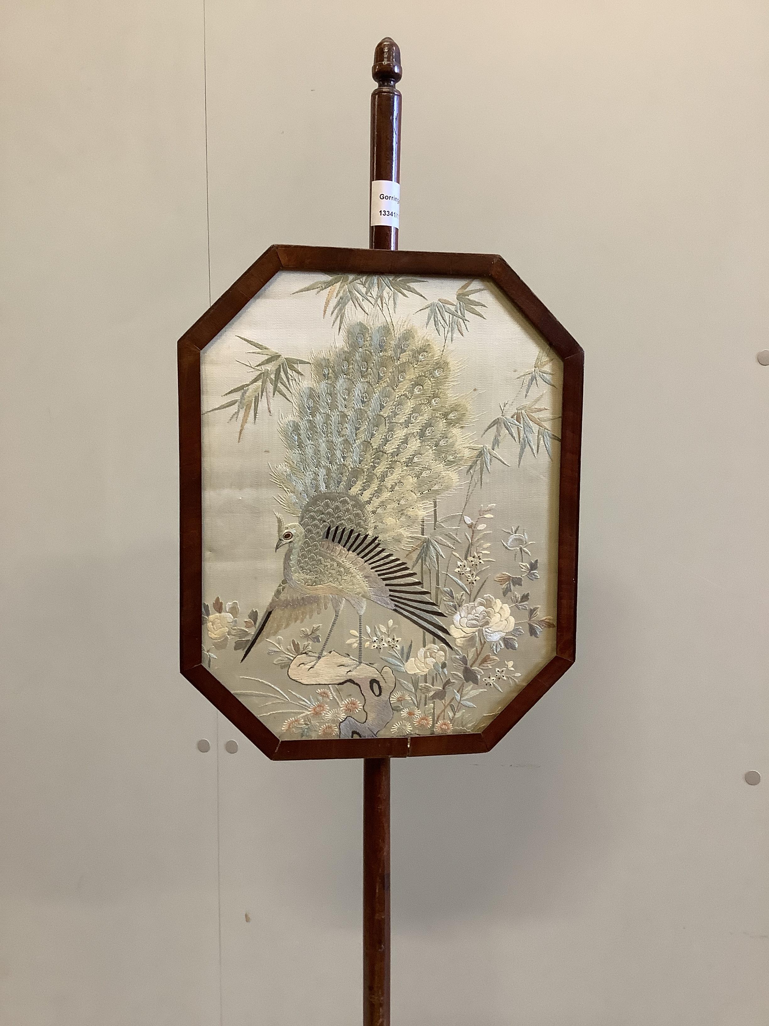 An Edwardian polescreen with octagonal Japanese silk thread banner, height 154cm